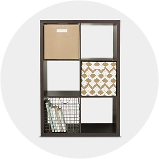 white storage shelves with baskets