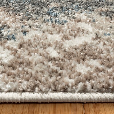 Blue and Beige Tufted Rectangular 5' x 7' Synthetic Area Rug