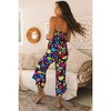 Amaryllis Women's Strapless Ruffle Hem Jumpsuit Smocked Waist Wide Leg Flowy One-Piece Effortless Outfit - 4 of 4