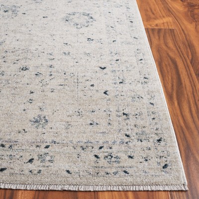Ivory and Blue Distressed Polyester Area Rug 9' x 11'6"