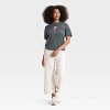 Women's Peanuts Snoopy Bow Short Sleeve Graphic Oversized T-Shirt - Gray - 3 of 3