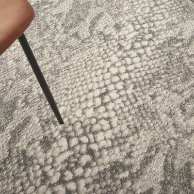Ivory and Grey 5' x 7' Animal Print Synthetic Area Rug