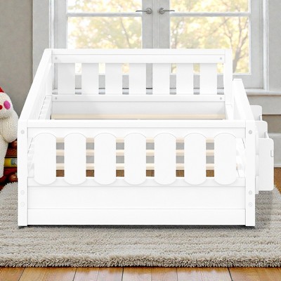 Front view of white wooden kids bed with guard rail