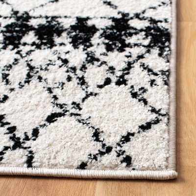 Ivory/Black Synthetic 6' x 9' Hand-Knotted Boho-Chic Area Rug