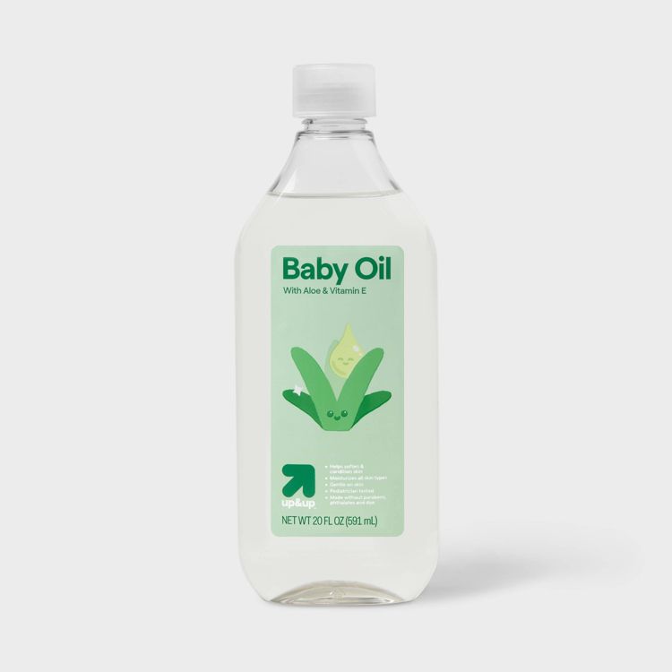 Clear plastic bottle of baby oil with aloe and vitamin E, labeled 20 fl oz (591 ml).