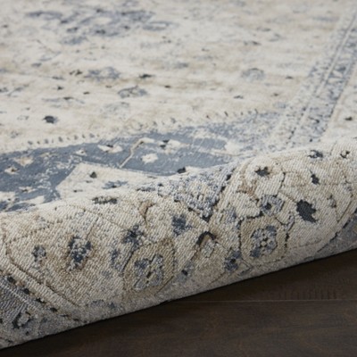Ivory and Blue Geometric Floral Synthetic Area Rug