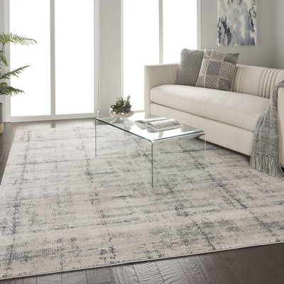 Ivory and Blue Abstract Synthetic 9x13 Area Rug