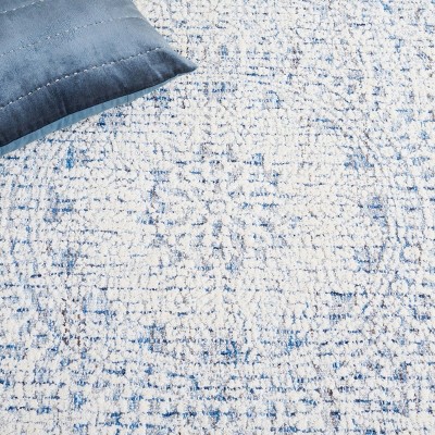 Blue and Ivory Hand Tufted Wool Area Rug 5' x 8'