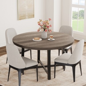 Round dining table, modern industrial-style kitchen table, sturdy metal base - 1 of 4