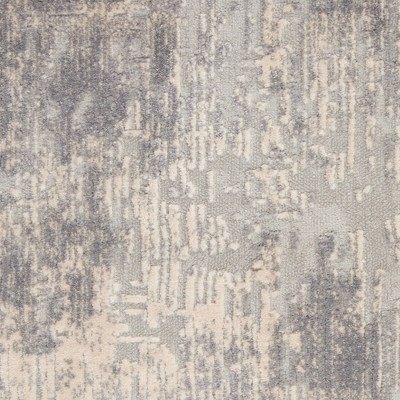 Ivory Abstract Power-Loomed Synthetic 5'3" x 7'3" Area Rug