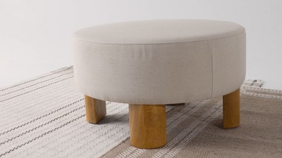 Celia Round Beige Upholstered Ottoman with Natural Wood Legs