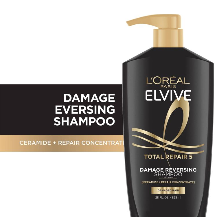 Black colored bottle of L'Oréal Paris Elvive Total Repair 5 Damage Reversing Shampoo with a pump top, labeled as 28 fl. oz. (828 ml).