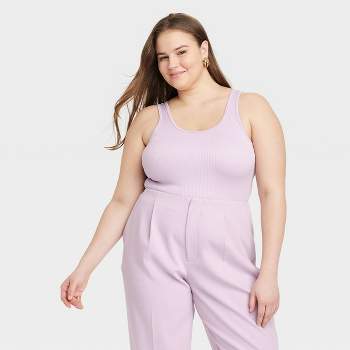 Women's Plus Size Solid Color Seamless Tank Top. • Round Neckline •  Sleeveless • Curve-Hugging • Body Contouring • Solid Color • Super Soft •  Stretchy - One size fits most plus