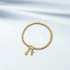 Free bird Cross Birthstone Bracelet | Dainty 14K Gold Plated Cross Charm Bracelet | Stretchable Elastic Gold Beaded Bracelet - 2 of 4