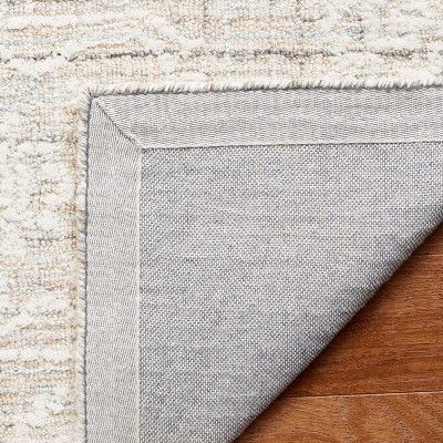 Ivory Tufted Wool 4' x 6' Rectangular Area Rug