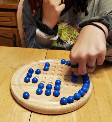 WE Games Solid Wood Solitaire with Blue Glass Marbles - 9 in. Diameter