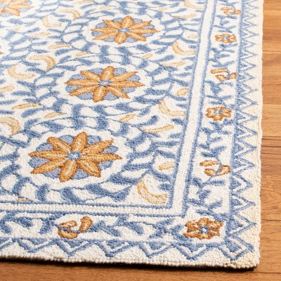 Ivory and Blue Hand-Hooked Floral Wool Area Rug, 9' x 12'