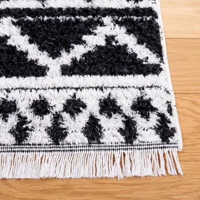 Augustine Black and Ivory Flat Woven Synthetic Area Rug