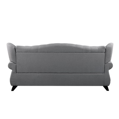 Gray Fabric Camelback Sofa with Floral Cushions and Nailhead Trim