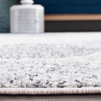 Ivory and Blue Geometric Pattern Rectangular Synthetic Rug