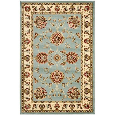 Ivory and Blue Floral Synthetic 4' x 6' Rectangular Rug