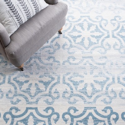 Ivory and Turquoise 8' x 10' Hand-Knotted Synthetic Area Rug