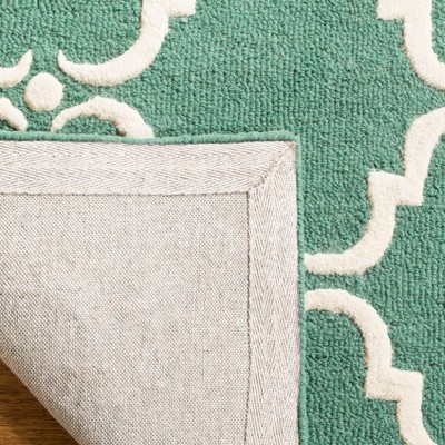 Teal and Ivory Hand-Tufted Wool 6' x 9' Area Rug