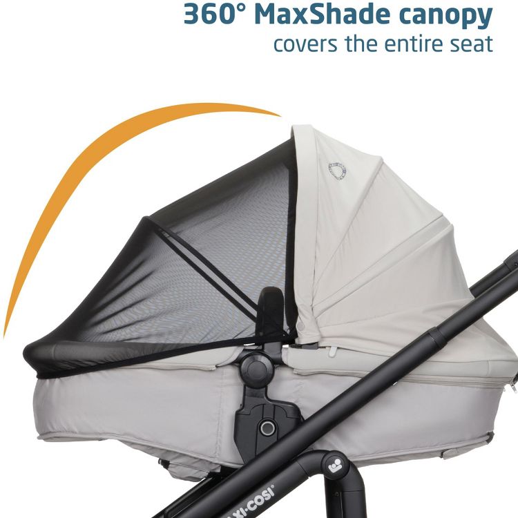A stroller with a light gray colored seat and a black mesh 360° MaxShade canopy covering the entire seat.