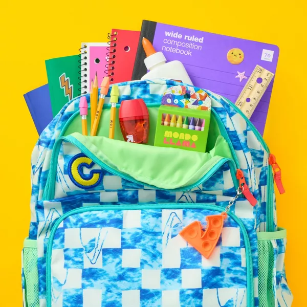 Backpack filled with school supplies.