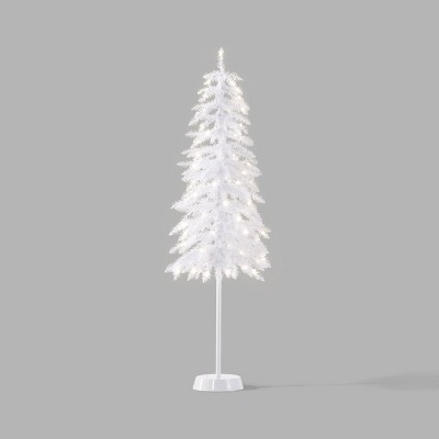 Artificial christmas branch on white