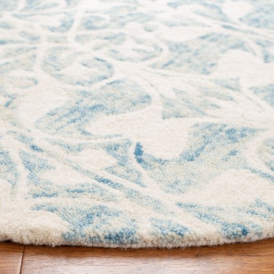 Hand-Tufted Dark Blue and Ivory Round Wool Rug