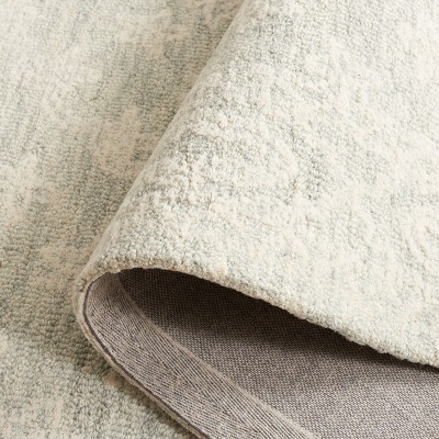 Handmade Light Blue Wool Tufted 6' x 9' Rectangular Rug