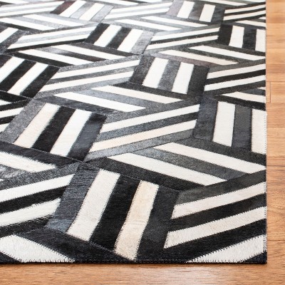 Handmade Black and Ivory Geometric Cowhide Area Rug
