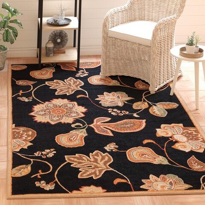 Handmade Black and Orange Floral Wool Area Rug