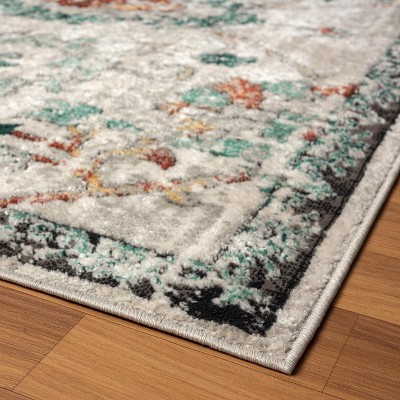 Green Floral Distressed 6' x 9' Synthetic Area Rug
