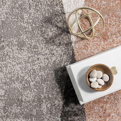 4' x 6' Red and Beige Abstract Synthetic Area Rug