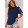 Amaryllis Women's Textured Puff Sleeve Top with Embroidered Details Elegant Relaxed Fit Chic Blouse - 2 of 4