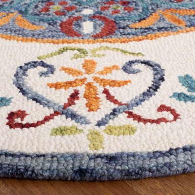 Handmade Blue and Ivory Round Tufted Wool Rug