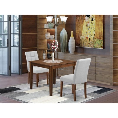 East West Furniture 3 Piece Dining Room Table Set consists A Wooden Table and 2 Light Gray Faux Leather Parson Dining Chairs Antique Walnut