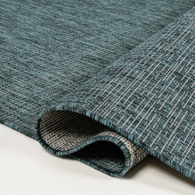 Turquoise and Cream 4' x 6' Solid Synthetic Area Rug