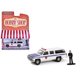 1985 GMC Suburban 2500 "NYC Transit Police Department" White with Blue Stripes and Figure 1/64 Diecast Model Car by Greenlight - 1 of 3