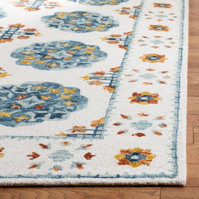Handmade Blue Floral Wool 5' x 8' Tufted Area Rug