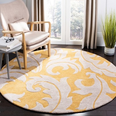 Handmade Round Gold and Ivory Wool Area Rug