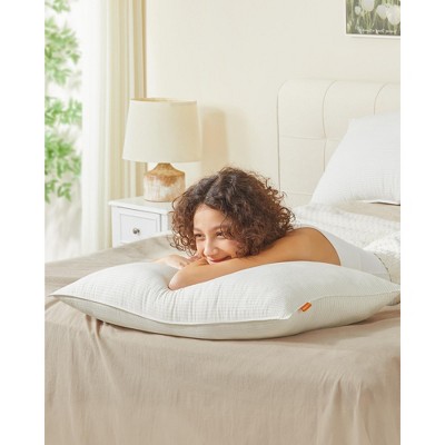 Set of 2 King-size cloud white bed pillows. They are down-alternative hotel-quality pillows with a skin - friendly viscose cooling seersucker cover.