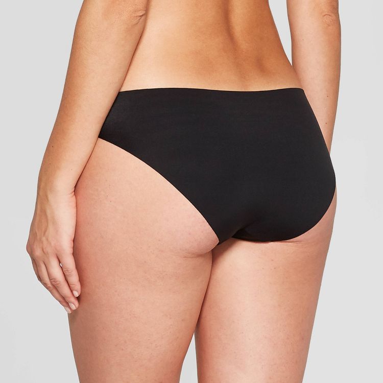 Black colored underwear with a seamless design shown from the back.