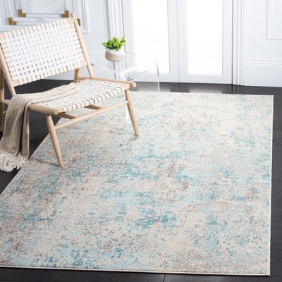 Ivory and Teal 4' x 6' Synthetic Non-Slip Rectangular Rug