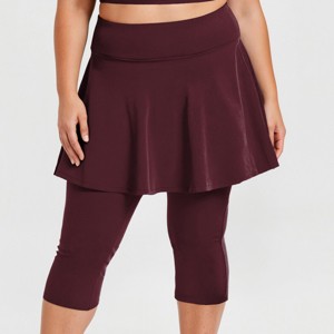 Calypsa Women's Plus Size Chlorine Resistant High Waisted Flared Swim Skort With Attached Capri Leggings - 1 of 3