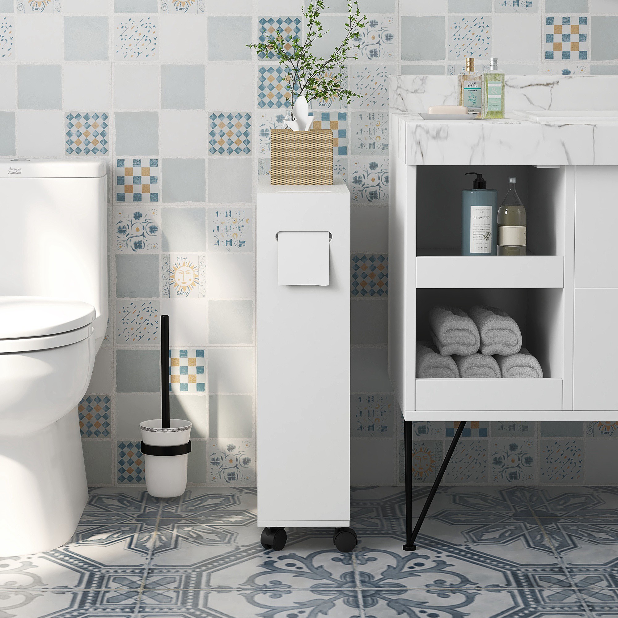 White bathroom storage cabinet on wheels next to a sink vanity.