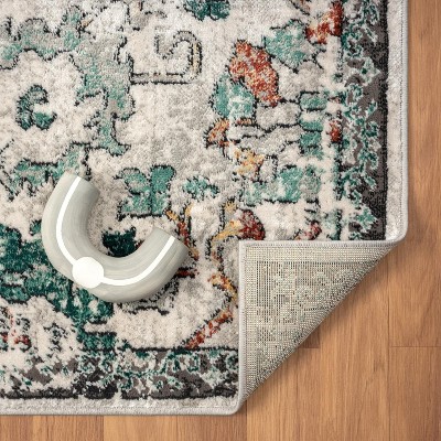 Green Floral Distressed 6' x 9' Synthetic Area Rug