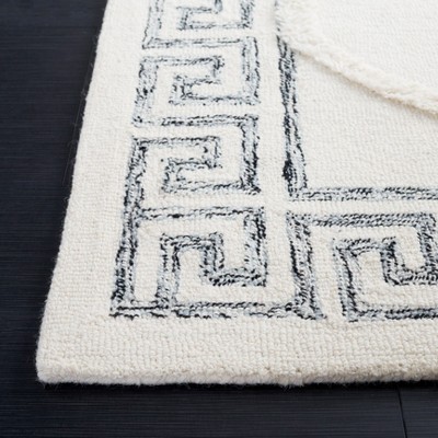 Ivory and Black 5' x 8' Hand Tufted Wool Shag Rug